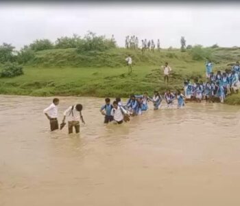 students_cross_drain_to_get_to_